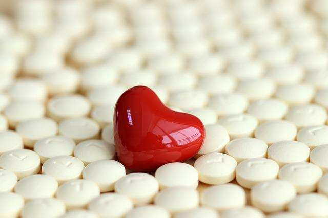 heart-shape toy in a bunch of white tablets