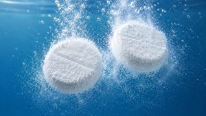 Compresse effervescenti che rilasciano polvere sottile