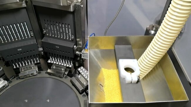Micro-pellet feeding system designed for stable and accurate filling of pellet materials into hard capsules. Micro-pellet feeding system designed for stable and accurate filling of pellet materials into hard capsules.