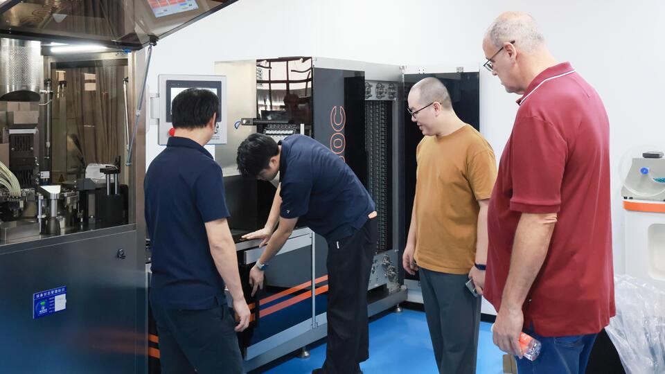 Engineer Demonstrates the Sealing Station of the Liquid Capsule Machine to the Client